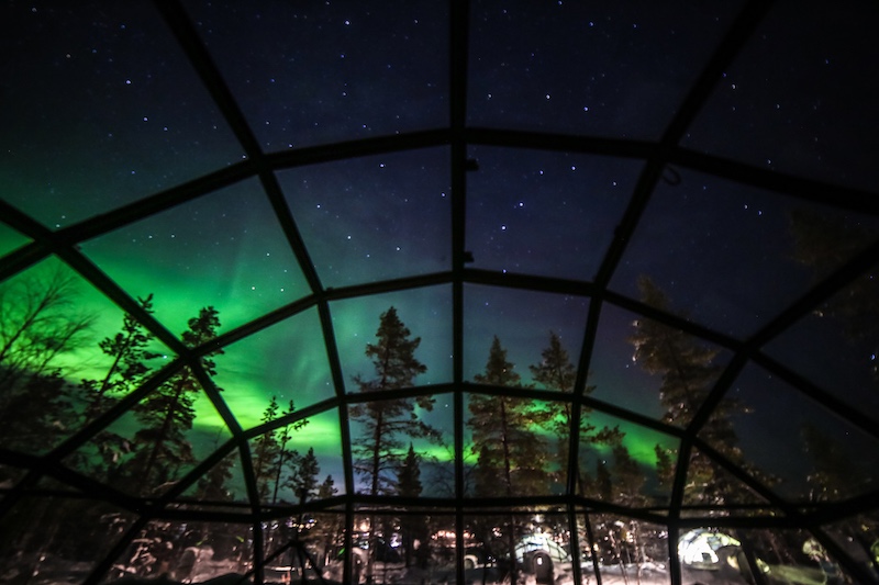 Northern Lights seen from a glass igloo at Kakslauttanen Arctic Resort, Saariselkä, Lapland, Finland. Photo: Getty Images