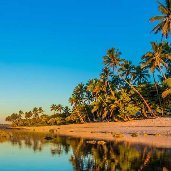 Two people standing on the beach, Fiji