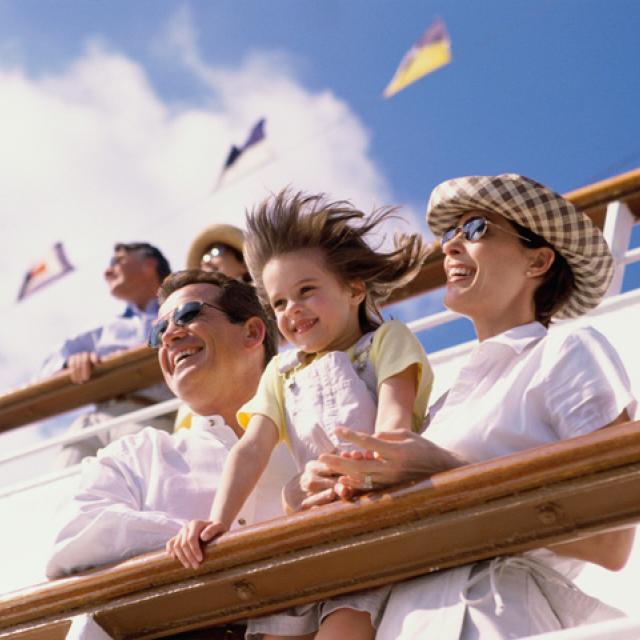 Parents with their daughter on the deck of a cruise ship